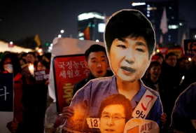 Woman at center of South Korea scandal shouts out her innocence 